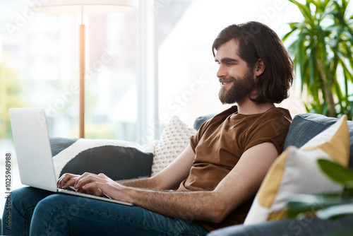 Laptop, happy and man in home typing email for connectivity, contact and networking for startup business, Computer, communication and male freelance copywriter relax in living room with remote work.