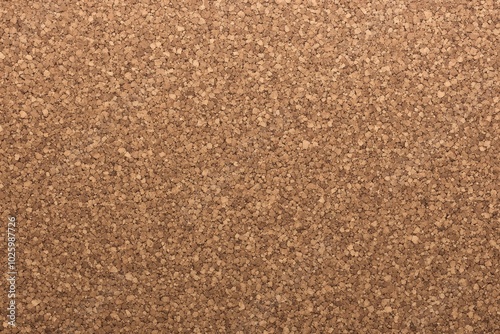 A close-up of a cork surface, perfect as a neutral background or texture. This simple yet versatile image can be used in design projects, presentations, or as a backdrop.
