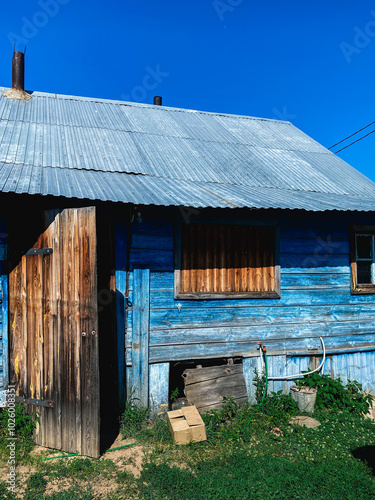 A small, traditional house in a Russian village photo