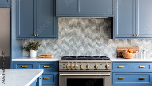 Blue kitchen cabinets with a herringbone backsplash and brass hardware