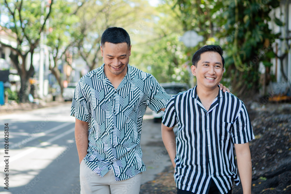 Obraz premium Two close friends are happily walking and laughing together in a lively urban setting