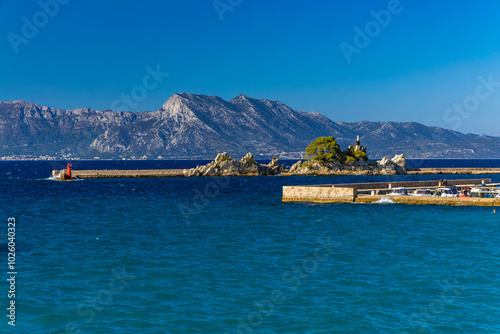 The port of Trpanja and the statue of Our Lady Star of the Sea photo