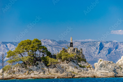 The port of Trpanja and the statue of Our Lady Star of the Sea photo