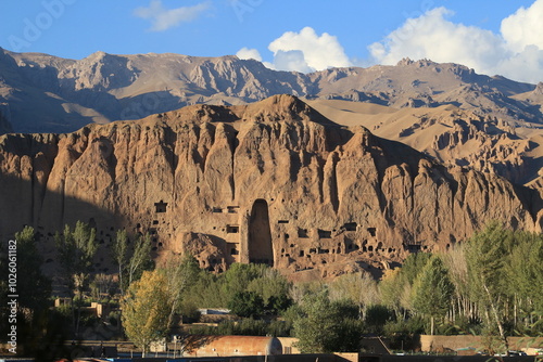 The Buddha statues of Bamiyan were two colossal Buddha figures carved into the cliffs of the Bamiyan Valley in Afghanistan in the 6th century AD. These statues were considered some of the largest anci photo