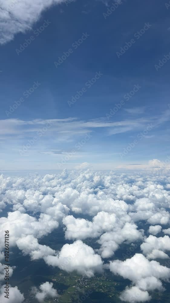 Blue sky with white fluffy clouds from airplane flight fly over the clouds. Blue sky with white fluffy clouds from airplane flight fly over the clouds.