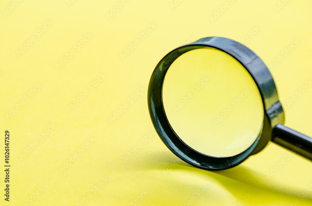 Side view of close up of magnifying glass with customizable space for text or ideas Side view of close up of magnifying glass with customizable space for text or ideas