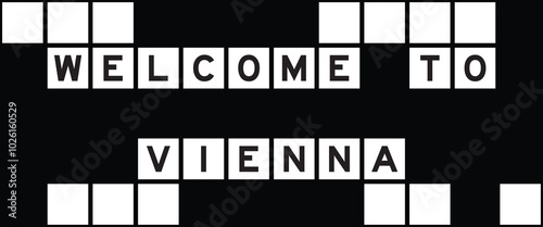 Alphabet letter in word welcome to vienna on crossword puzzle background