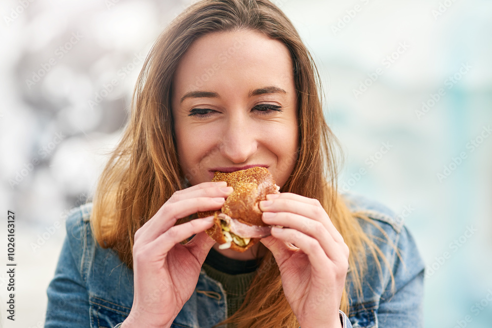 Park, lunch and happy woman eating a burger on outdoor break for meal or taste craving. Breakfast, fast food and young female person outside enjoying sandwich, takeout or unhealthy snack in Germany Park, lunch and happy woman eating a burger on outdoor break for meal or taste craving. Breakfast, fast food and young female person outside enjoying sandwich, takeout or unhealthy snack in Germany