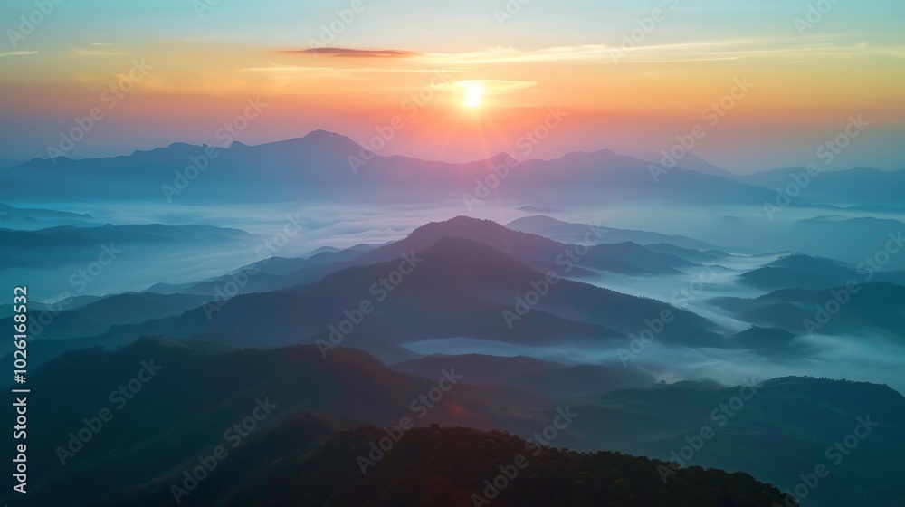 Obraz premium Sun Rising Over Misty Mountain Range