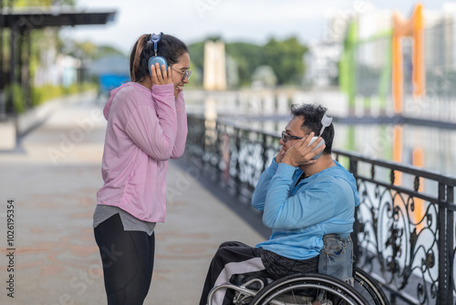 Couple Choosing Playlist, Listening to Music with Headphones