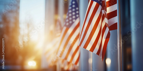 image captures beautiful scene of American flags waving gently in sunlight, creating patriotic atmosphere. warm glow enhances feeling of pride and unity