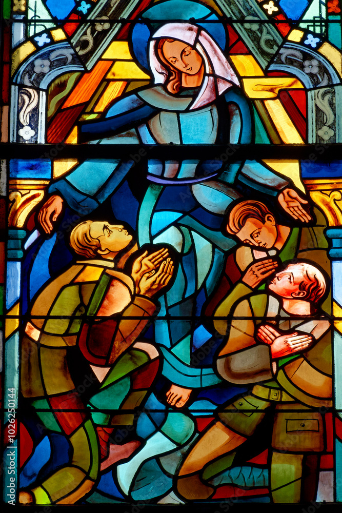 2024-08-01, Paris, FRANCE. Stained glass of the Virgin Mary protecting soldiers. . 2024-08-01, Paris, FRANCE. Stained glass of the Virgin Mary protecting soldiers. .