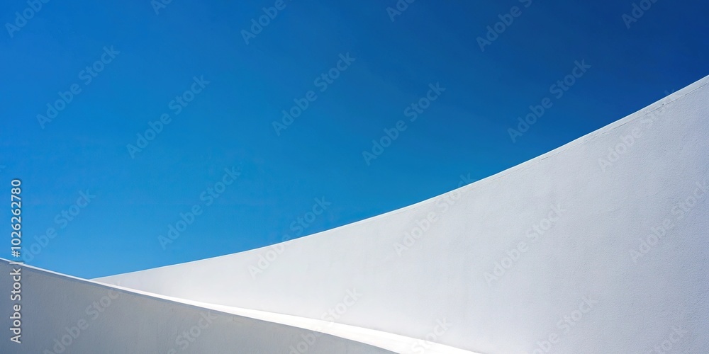 Minimalist white wall against blue sky Minimalist white wall against blue sky