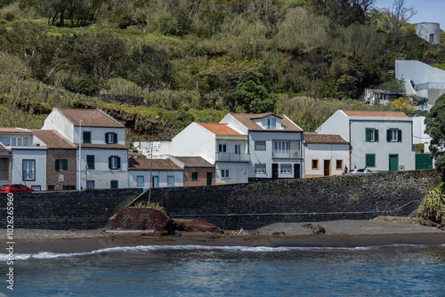 Traditional houses on the cliff at Atlantic ocean coast in Sao Miguel Azores islands Portugal