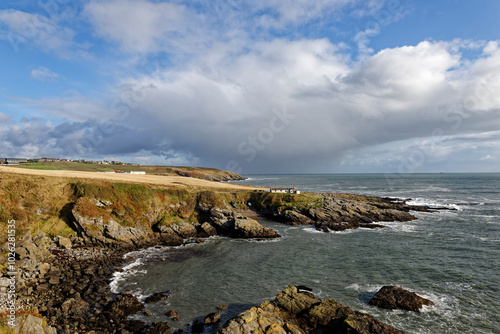 A view of Portlethen Bay near to Stonehaven looking north with the Old Salmon Fishing Station on the headland with the small harbour below. photo