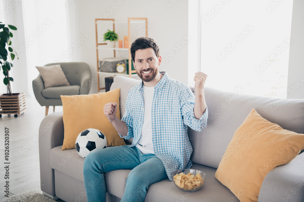 Photo of handsome bearded alone mature age adult man staying home loves football games support favorite premiere league Photo of handsome bearded alone mature age adult man staying home loves football games support favorite premiere league