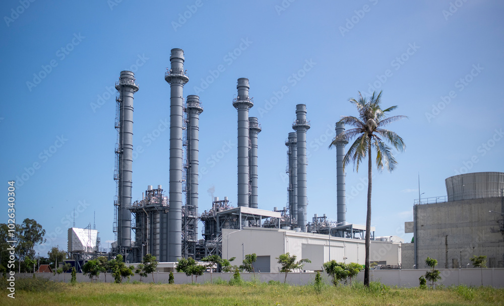 Industrial chimneys or smokestacks, likely part of a power plant or industrial facility is industrial atmosphere with a focus on the infrastructure. Industrial chimneys or smokestacks, likely part of a power plant or industrial facility is industrial atmosphere with a focus on the infrastructure.