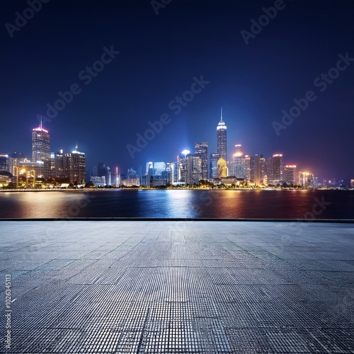 empty road sidewalk with the the city at night in the background with copy space