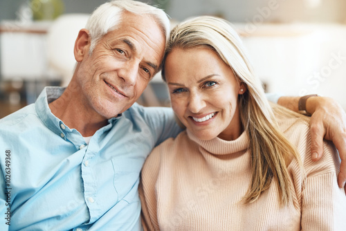 Portrait, mature couple and smile on sofa in home with romance, relax and affection in marriage. Happy people, embrace and love on couch in lounge for support, security and commitment in relationship