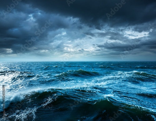 rough blue ocean under dark sky