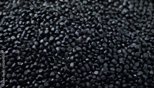 Black plastic, polymer pellets for the production of plastic products. Close-up