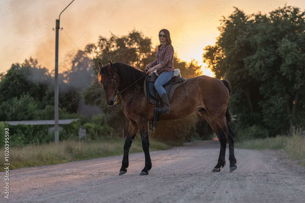 Portrait of a young beautiful dark-haired girl with a horse outdoors. Portrait of a young beautiful dark-haired girl with a horse outdoors.