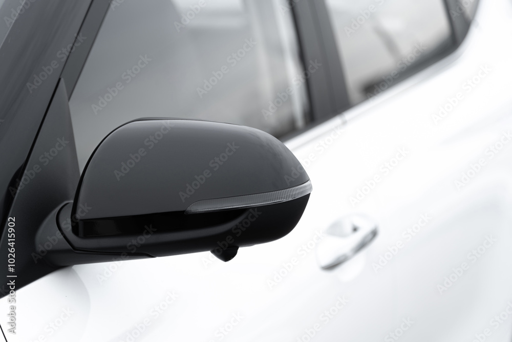 white car side view with rear view mirror, car dealing and manufacturing, cropped car image, selective focus white car side view with rear view mirror, car dealing and manufacturing, cropped car image, selective focus