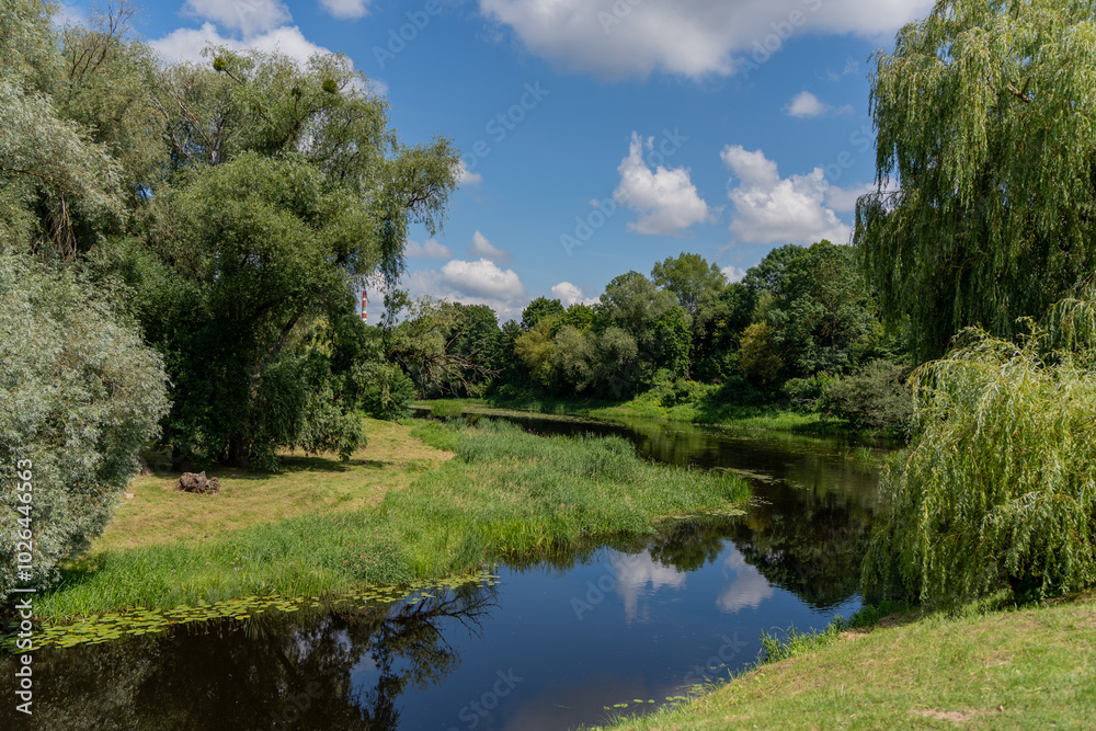 Tranquil river in a lush green park Tranquil river in a lush green park