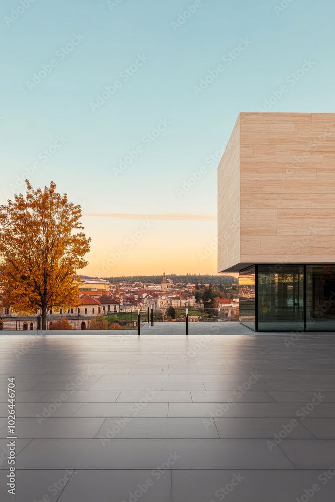 Obraz premium Modern architectural design with autumn trees and city skyline at sunset in serene landscape