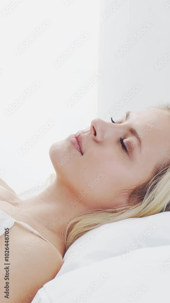 Peaceful, serene scene of a young woman sleeping comfortably in bed, with soft, natural lighting. Perfect for themes of relaxation, rest, and tranquility. Peaceful, serene scene of a young woman sleeping comfortably in bed, with soft, natural lighting. Perfect for themes of relaxation, rest, and tranquility.