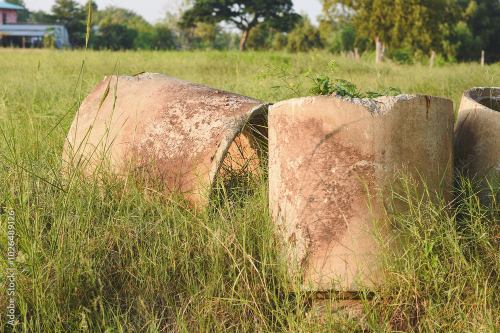Large cement pipes covered with green grass Large cement pipes covered with green grass
