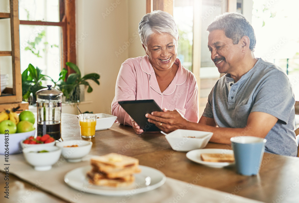 Breakfast, happy and senior couple with tablet for reading morning news, internet puzzle and story. Man, woman and technology in retirement home for article, online information and relax with food Breakfast, happy and senior couple with tablet for reading morning news, internet puzzle and story. Man, woman and technology in retirement home for article, online information and relax with food