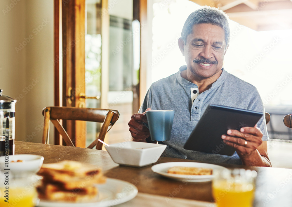 Coffee, breakfast and senior man with tablet for reading morning news, story and update in retirement. Tea, happy person and technology in home for article, online information and relax with drink Coffee, breakfast and senior man with tablet for reading morning news, story and update in retirement. Tea, happy person and technology in home for article, online information and relax with drink