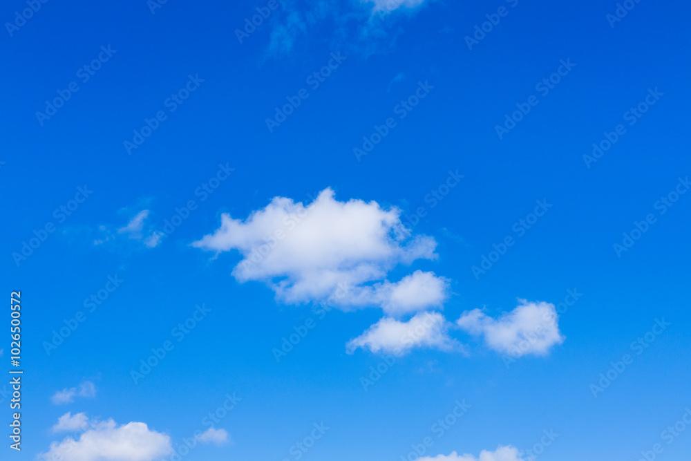 Beautiful blue sky and white fluffy group of clouds background in the morning skyline Beautiful blue sky and white fluffy group of clouds background in the morning skyline