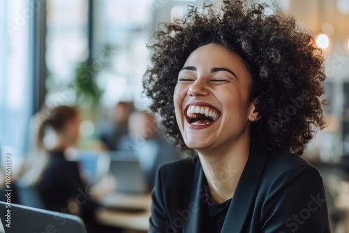 Diverse Woman Laughing in the Office While Working on Laptop Generative AI