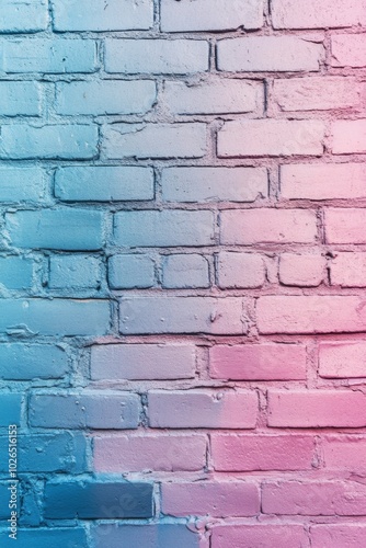 Colorful gradient brick wall painted in shades of pink and blue in an urban s...