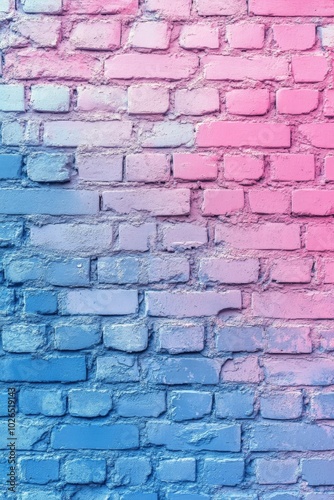 Colorful gradient brick wall painted in shades of pink and blue in an urban s...