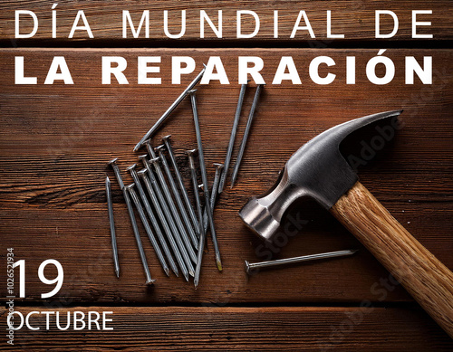 19 octubre dia mundial de la reparacion, con martillo y clavos sobre una tabla de madera photo