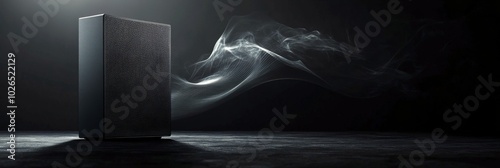 High quality black speaker system with dynamic sound waves against a dark bac...