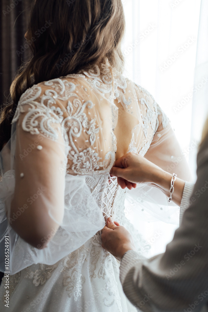 Fototapeta premium Bride and bridesmaids during the wedding preparations