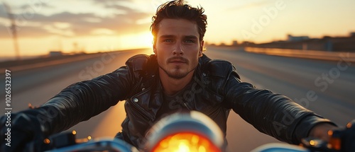 Rider enjoying a sunset motorcycle journey on an open road during golden hour