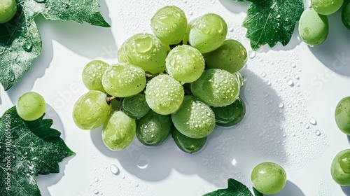 Fresh Green Grapes with Water Droplets and Vine Leaves photo