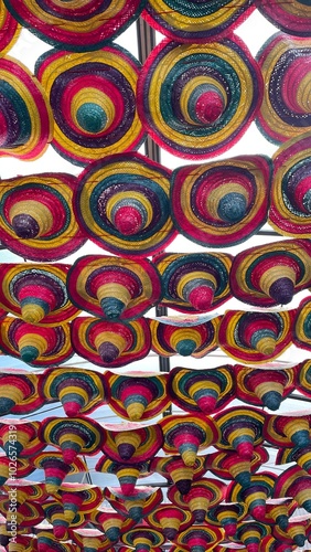 Spanish hats hung between buildings at carnival