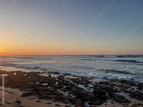 sunset on the rocky beach