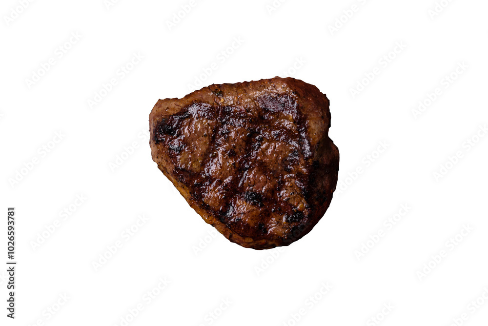 Juicy beef steak baked on the grill with salt, spices and herbs Juicy beef steak baked on the grill with salt, spices and herbs