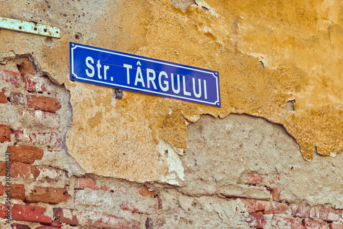 A close-up of a blue street sign for 