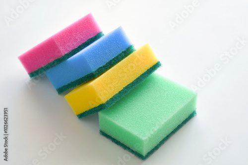 Sponges on white table. Household tools.