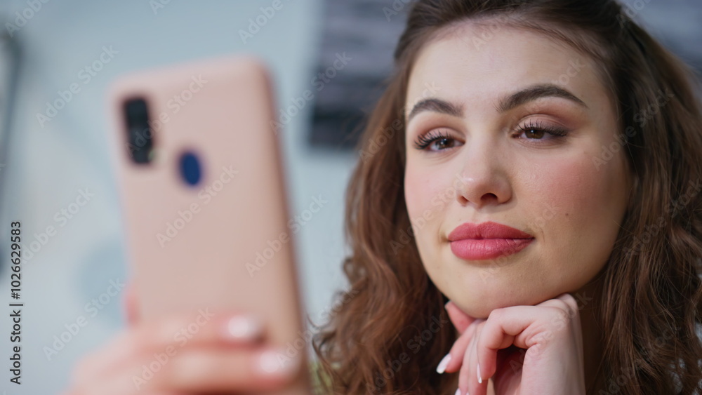 Office girl reading message smartphone in light interior closeup. Happy manager Office girl reading message smartphone in light interior closeup. Happy manager