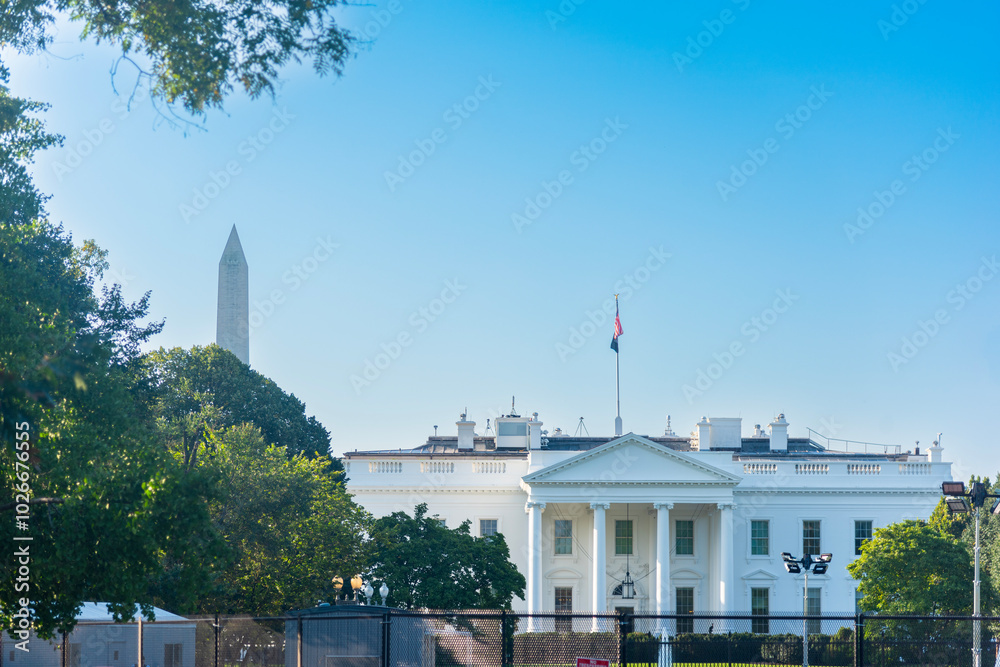 The White House with Washington Monument on the background on a sunny day