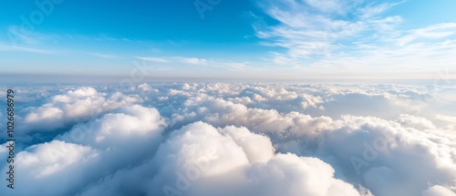  A blue sky dotted with wispy clouds, a few in the foreground